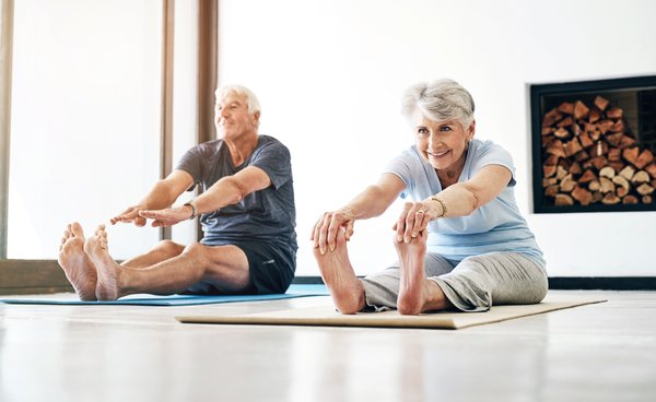 fitness-senior-couple-yoga-exercise-home